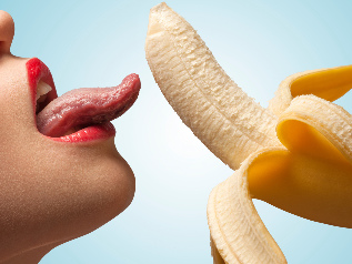 Girl licks banana